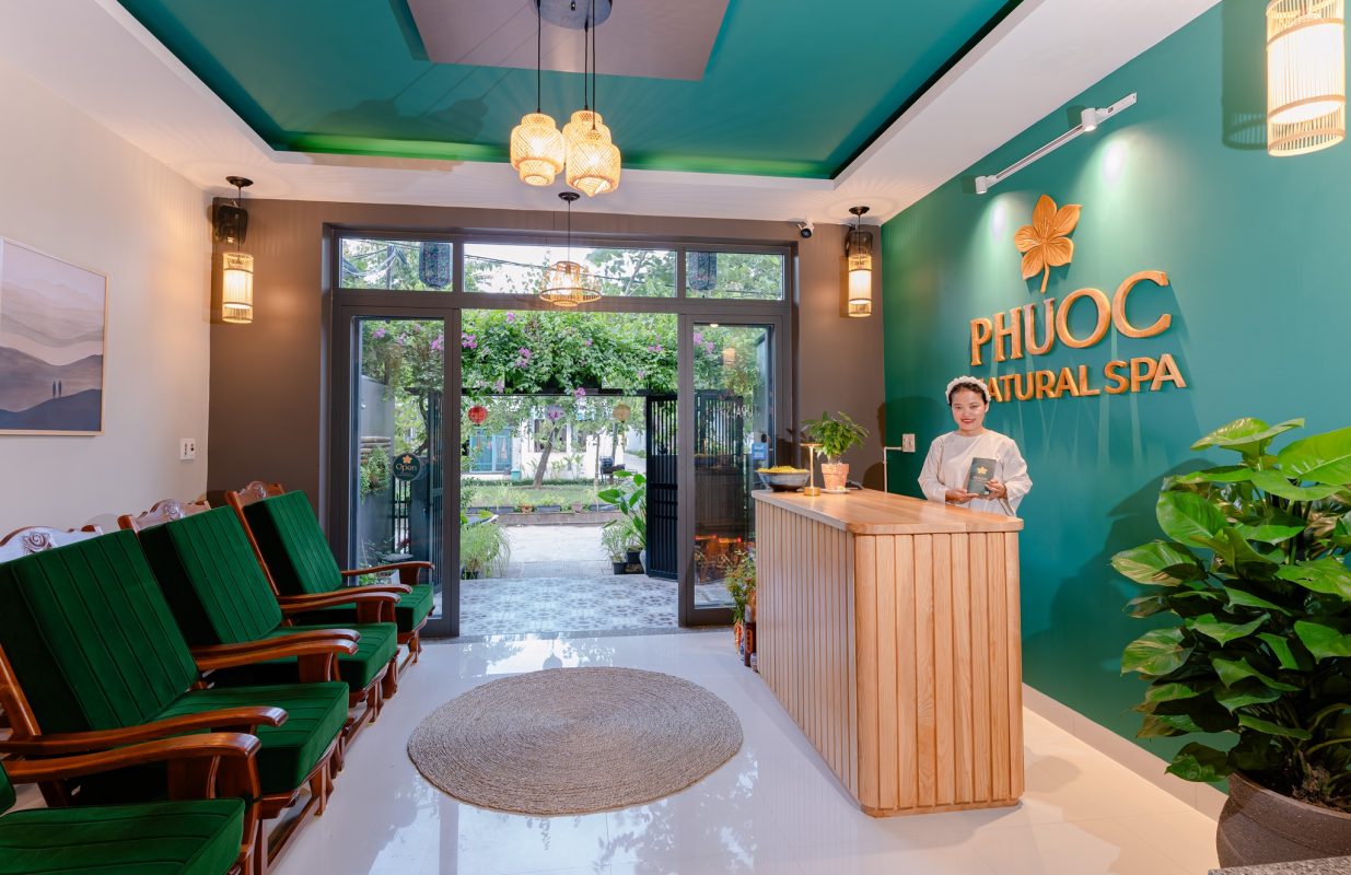 Interior view of the peaceful reception area and garden entrance at Phước Natural Spa in Hoi An