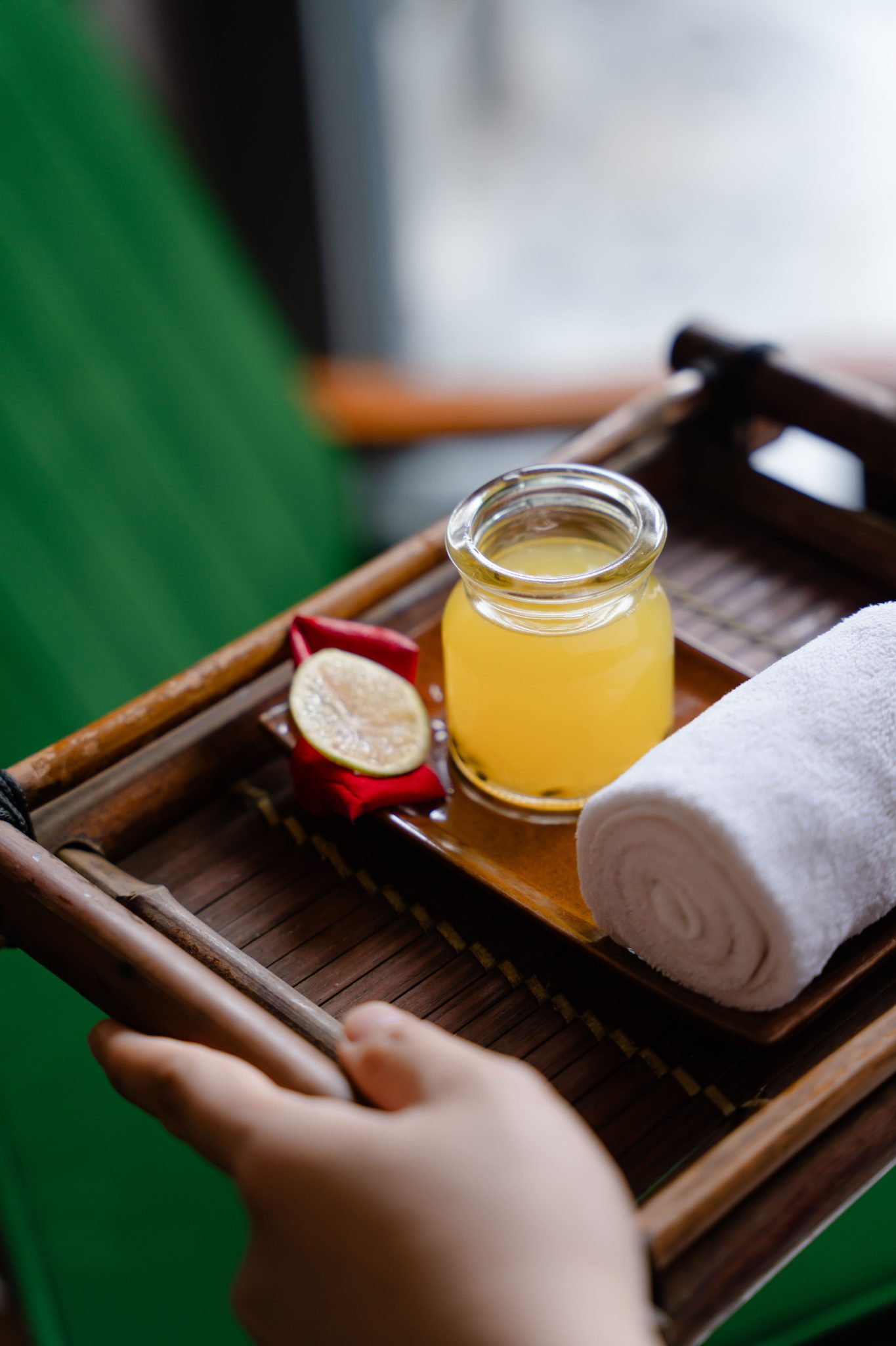 Fresh organic herbal tea and cold scented towels served to guests at Phước Natural Spa Hoi An
